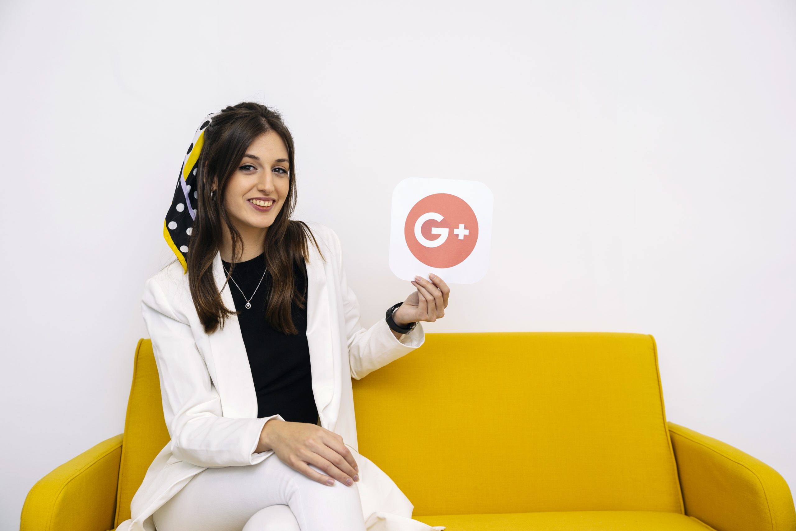young-stylish-businesswoman-showing-google-plus-icon-her-hand