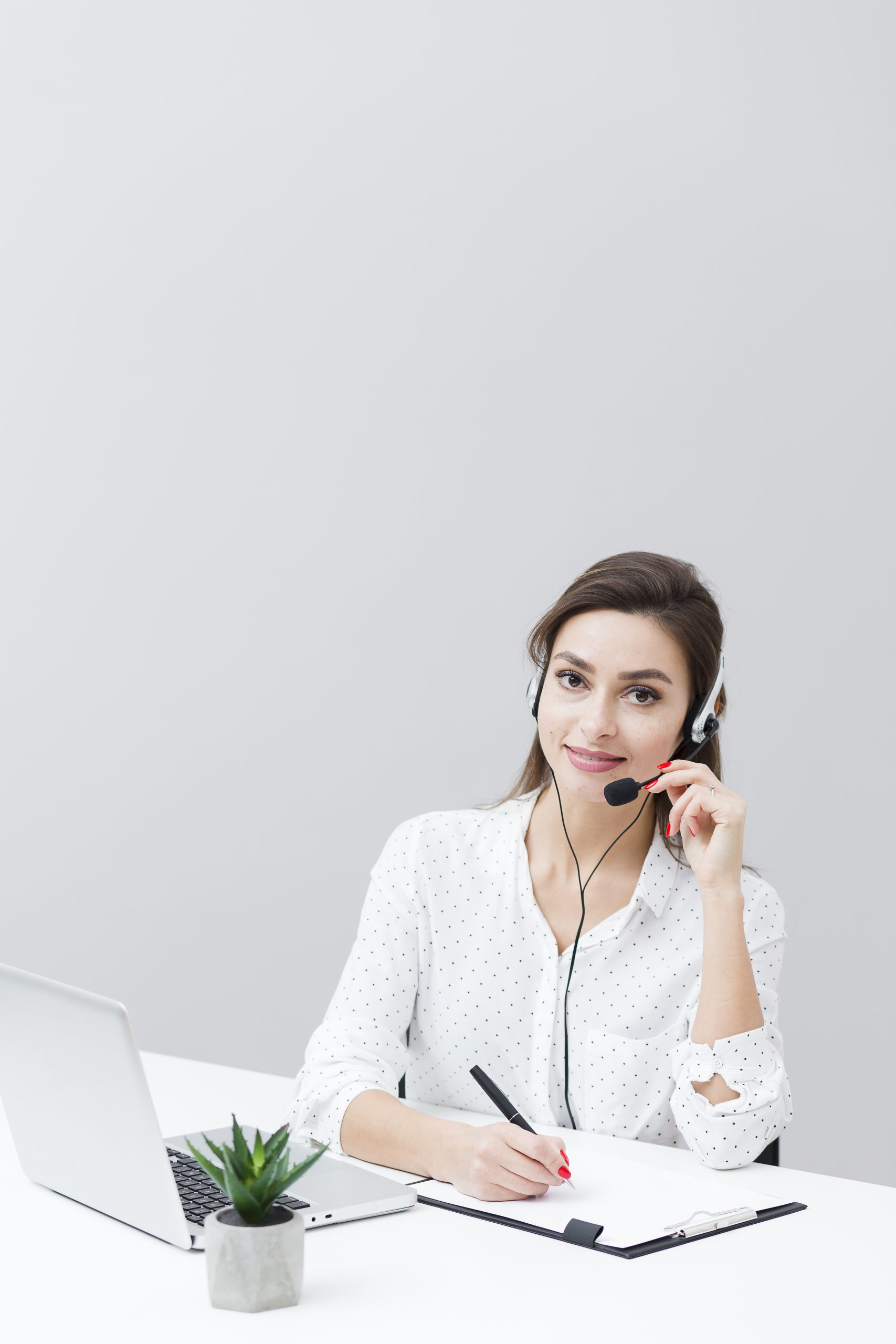 front-view-woman-wearing-headset-working-desk-with-laptop